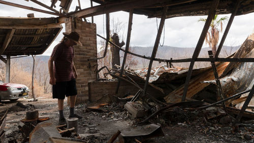 Philip Hine surveys the ruins of his property on January 14, 2020 in Wytaliba, Australia. Philip narrowly escaped the inferno that tore through the area on the afternoon of November 8, 2019, after first sheltering inside his home, before driving away in h