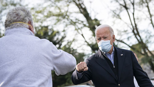 PHILADELPHIA, PA - NOVEMBER 03: Democratic presidential nominee Joe Biden fist bumps a supporter as he makes a stop with local elected officials at Relish Restaurant in Philadelphia, Pennsylvania.