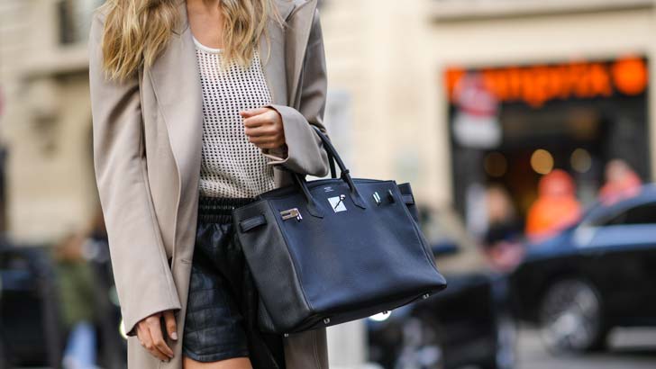 Xenia Adonts carrying her Hermes Birkin bag at Paris Fashion Week in March 2022