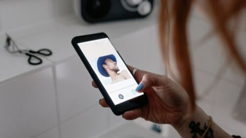 person-using-dating-app-on-smartphone