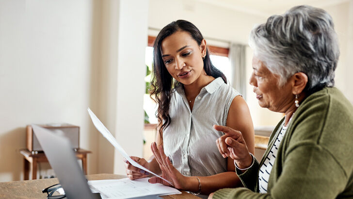 Mother reviewing superannuation paperwork with concern about death benefit