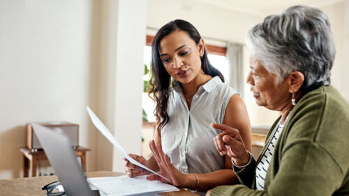 Mother reviewing superannuation paperwork with concern about death benefit
