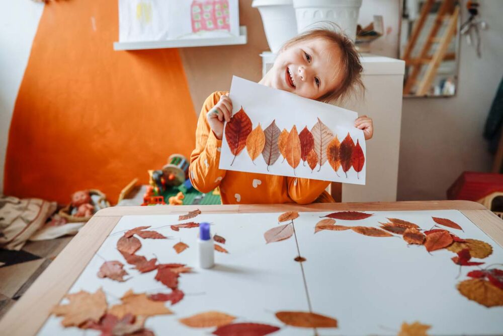 Parents and children making arts and crafts at home during the school holidays