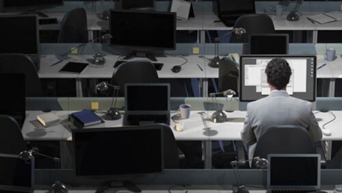 Australian office workers in a modern workplace, as economists watch labour market conditions and employment trends ahead of the latest jobs data release.