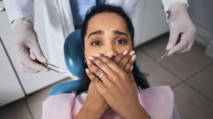 Australians are increasingly travelling overseas for cheaper dental implants, veneers and crowns, but experts warn the savings can come with hidden risks.