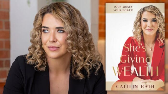 caitlin bath with the cover of her new book, she's giving wealth